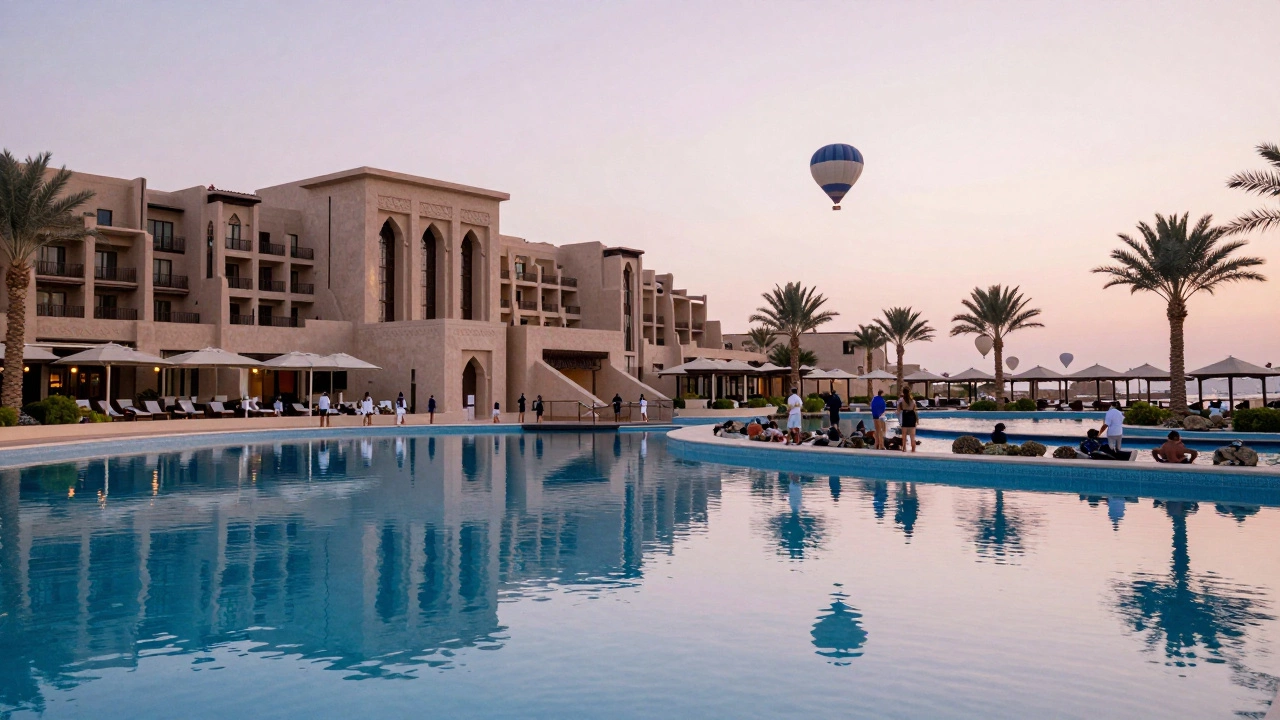Dawn view of an Egyptian Red Sea resort with reflective water and hot air balloons.